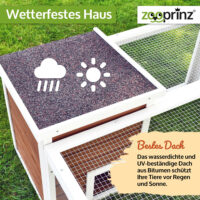 Offenes Freigehege mit Holzhaus für Schutz und Spielmöglichkeiten.