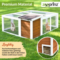 Offenes Freigehege mit Holzhaus für Schutz und Spielmöglichkeiten.