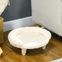 Komfortables cremefarbenes Haustiersofa aus Flanell mit Holzbeinen.