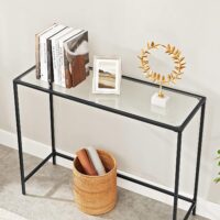 Konsolentisch Beistelltisch mit Glas und Metallrahmen in Schwarz.