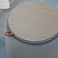 Eine runde graue Ottomane mit Stauraum und 2-in-1 Funktion.