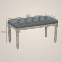 Graue Polsterbank im Vintage-Stil mit eleganter Knopfverzierung. Ein zeitloses Möbelstück für klassische Einrichtungen.
