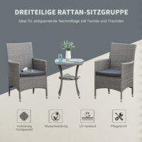 Dreiteiliges Rattan-Gartenmöbel-Set mit Tisch.