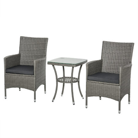 Dreiteiliges Rattan-Gartenmöbel-Set mit Tisch.