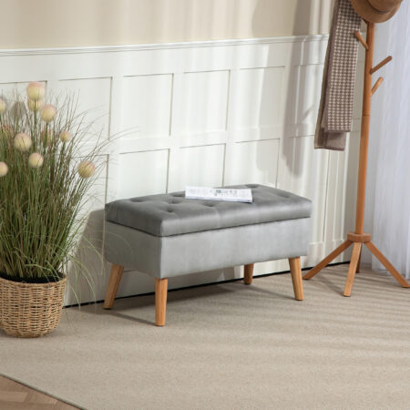 Graue Sitzbank mit stilvoller Samtoptik, integriertem Stauraum und Beinen aus massivem Gummiholz, perfekt für moderne Wohnräume.