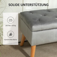 Graue Sitzbank mit stilvoller Samtoptik, integriertem Stauraum und Beinen aus massivem Gummiholz, perfekt für moderne Wohnräume.